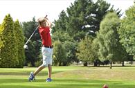 Person playing golf