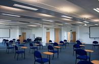 A conferencing room set up in the classroom style