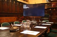 Exeter Guildhall conference room with tv screen
